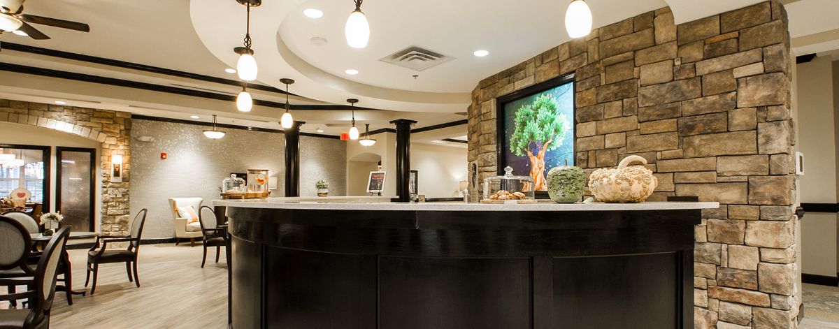 A modern reception area featuring elegant lighting, artwork, and contemporary interior design.