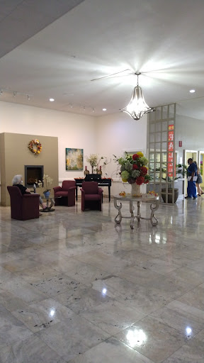 A cozy and inviting lobby area featuring comfortable seating and decorative elements.