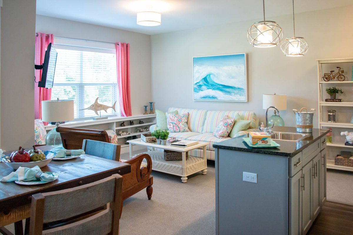 A modern living room with bright accents and an open layout.