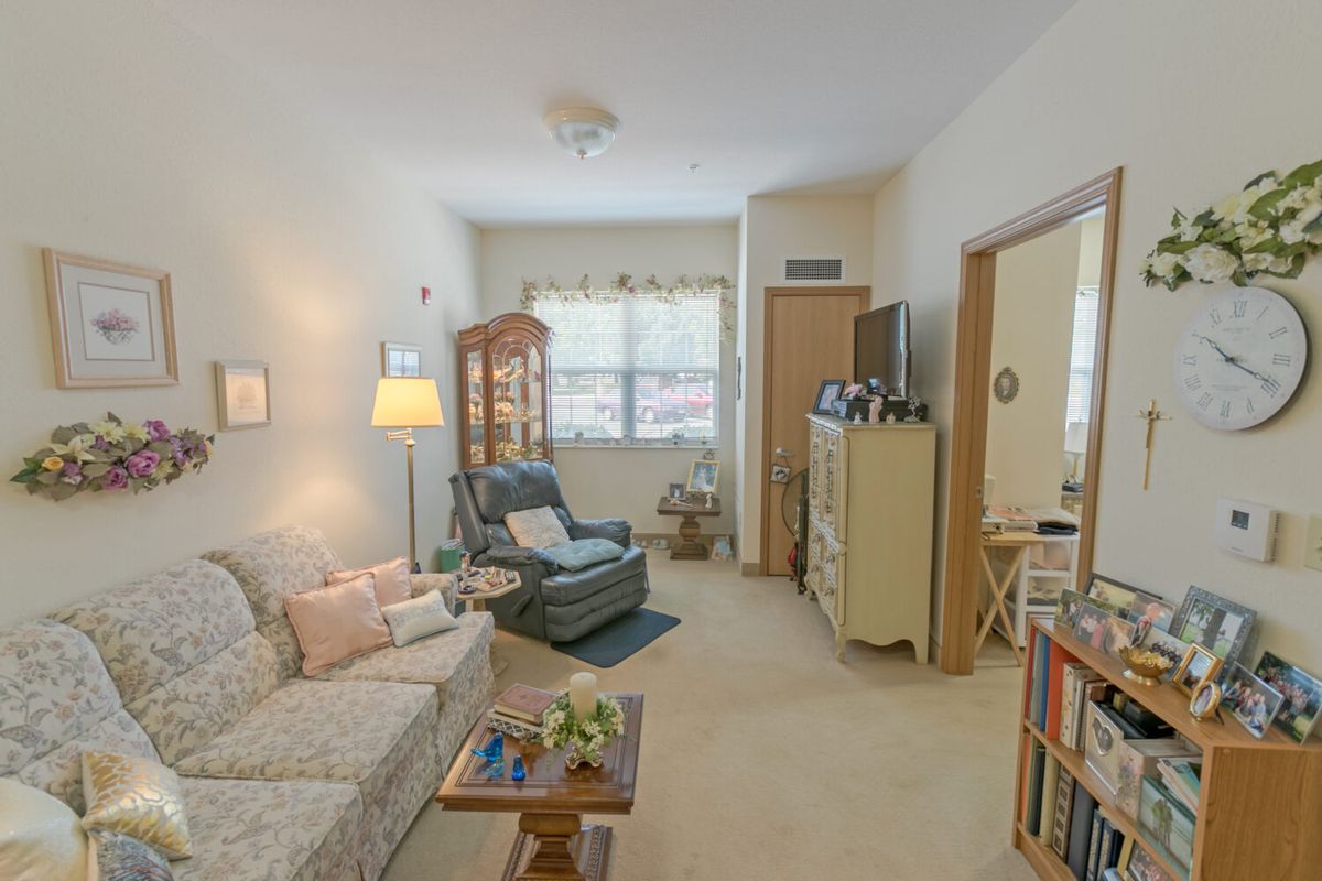A cozy living room with comfortable seating and soft lighting.