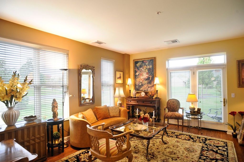 A cozy living room with elegant furniture and warm lighting.
