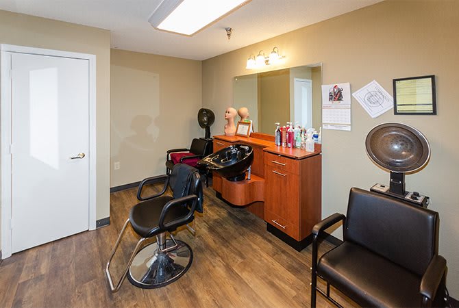 A cozy hair salon with styling chairs and equipment ready for clients.
