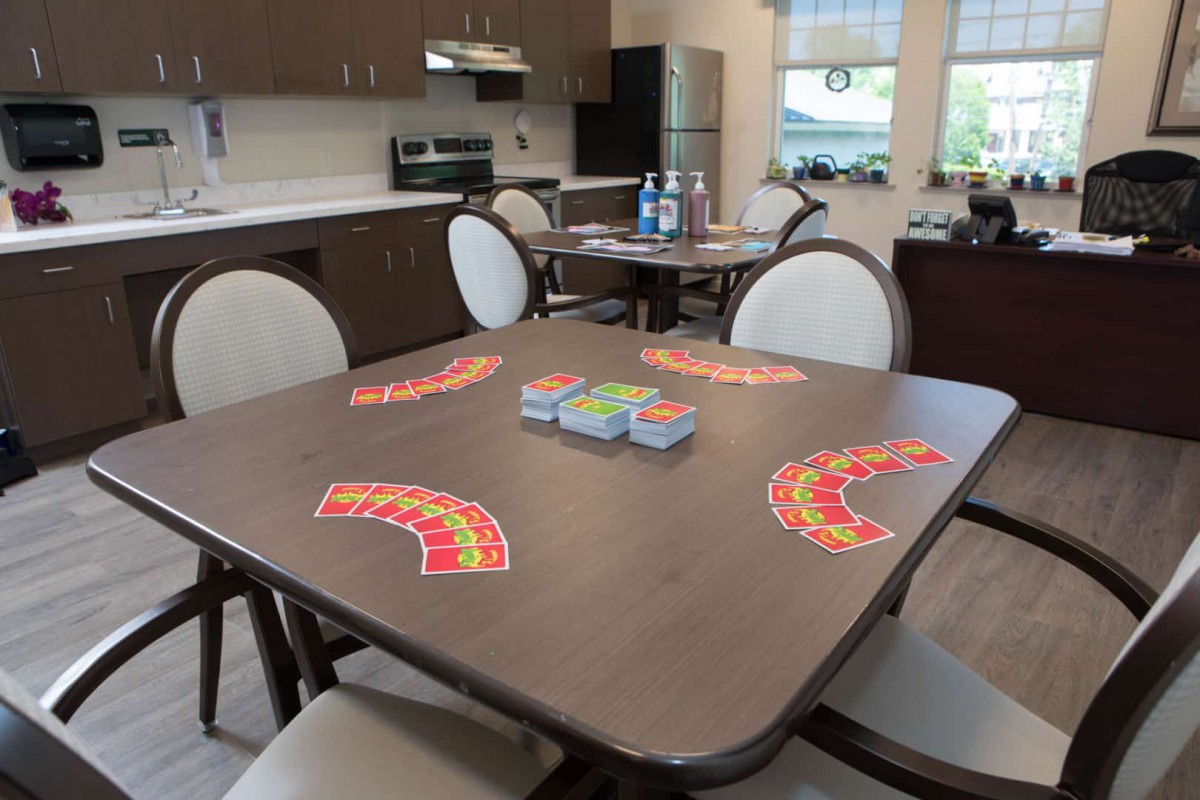 A kitchen area with a table set up for a card game.