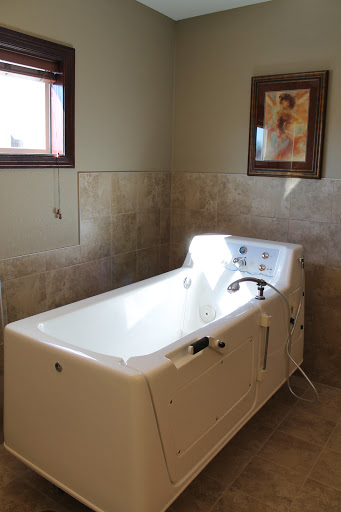 A modern bathtub in a serene bathroom setting.