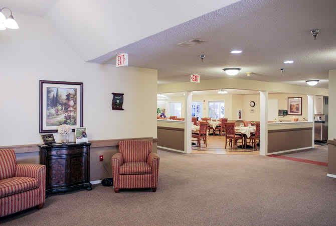 A welcoming lobby area with seating and a view into the dining area.