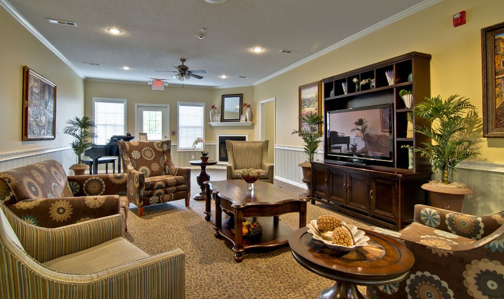A cozy living room with comfortable seating and a large entertainment center.