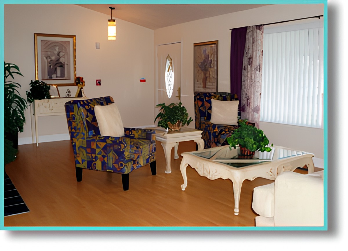 A cozy living room with patterned chairs, a white coffee table, and decorative artwork.
