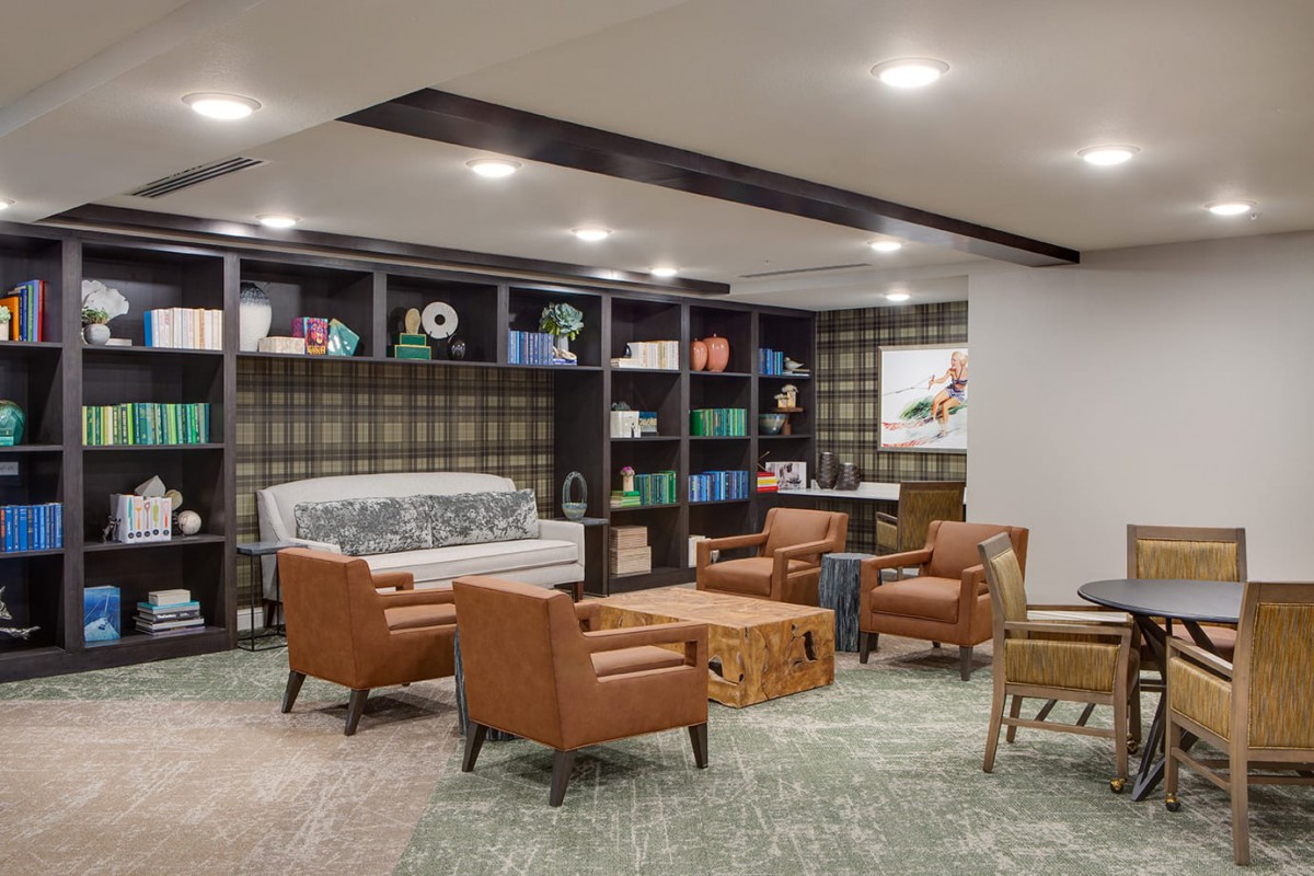 A modern living room with stylish furniture and a cozy seating area.