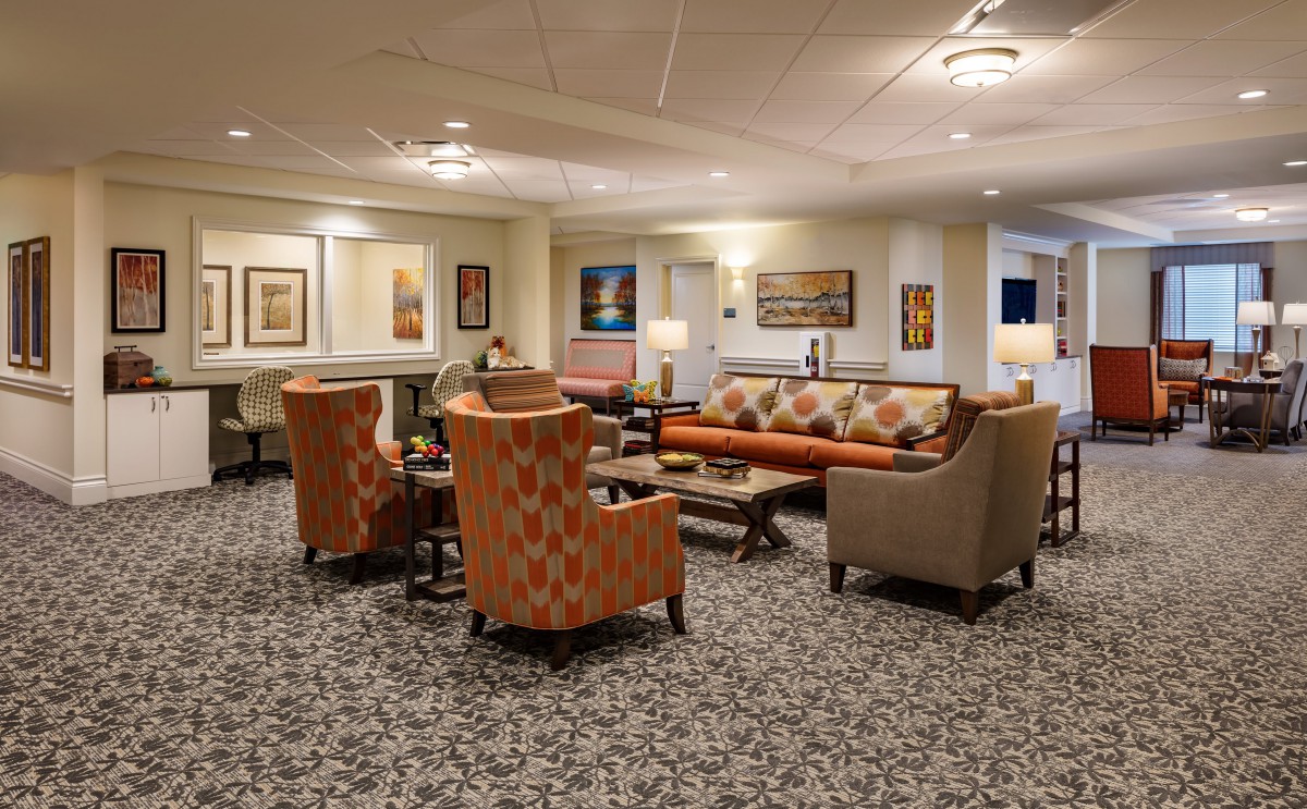 A cozy lobby with comfortable seating and warm lighting.