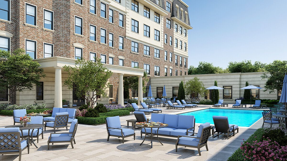A luxurious hotel with a stylish outdoor pool area and comfortable seating.