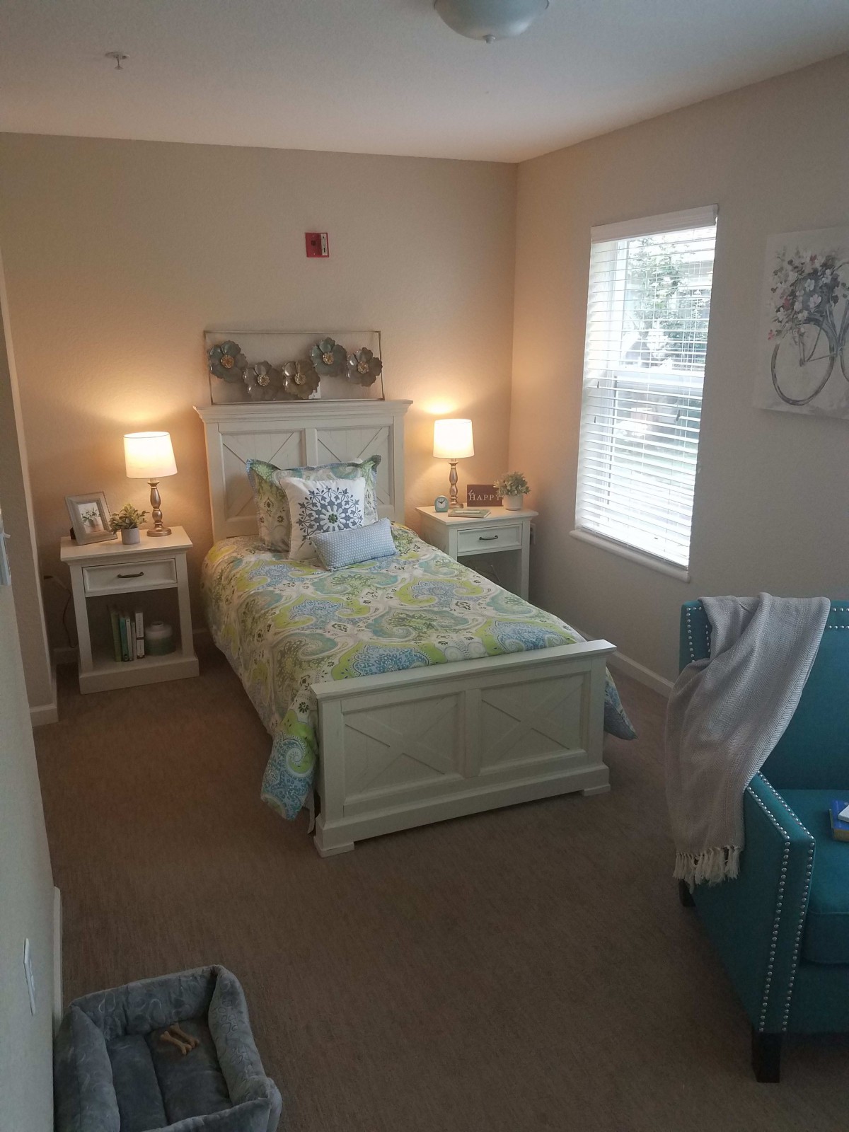 Cozy bedroom with a single bed and warm lighting.