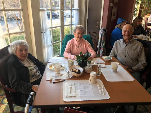 A warm gathering of friends enjoying a meal together.