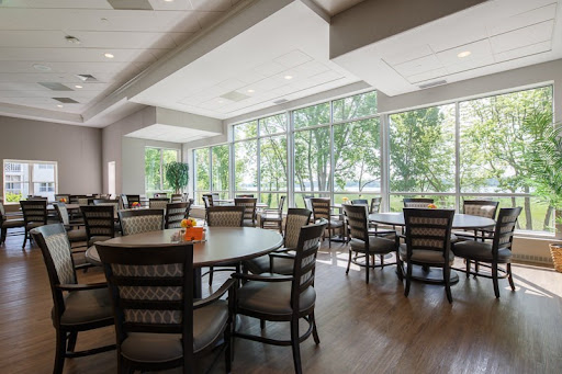A spacious and modern dining area with large windows providing plenty of natural light.