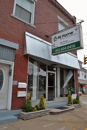 A storefront displaying a business named 'At Home' with clear signage.
