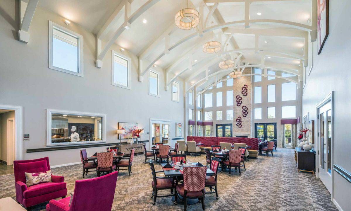 Spacious dining area with elegant decor and large windows.