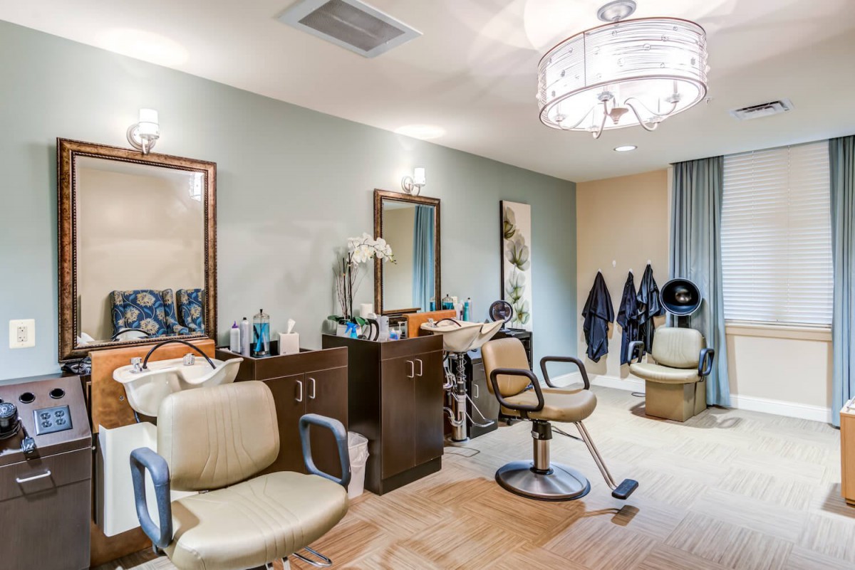 A cozy hair salon interior with styling chairs and mirrors.