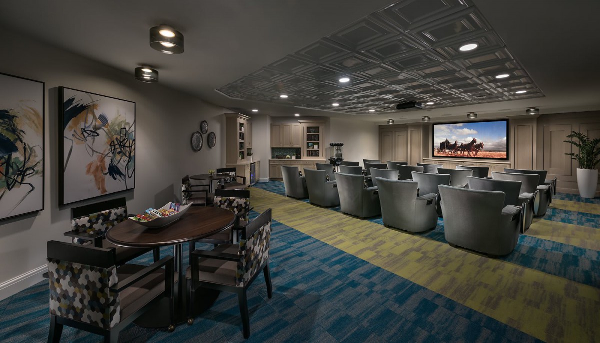 A modern home theater with comfortable seating and a large screen.