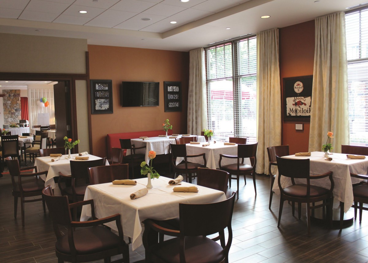 Elegant restaurant dining area with neatly arranged tables and chairs.