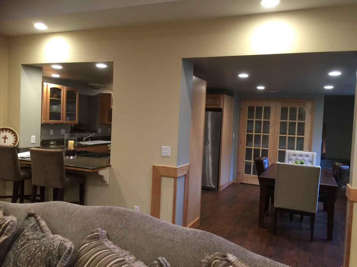 Open concept living area with a view into the kitchen and dining space.