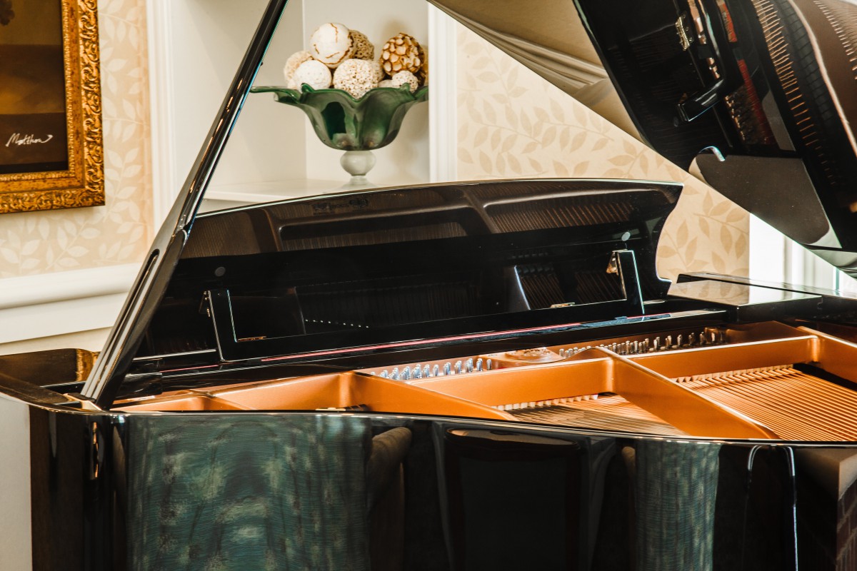 A grand piano in a well-decorated room.