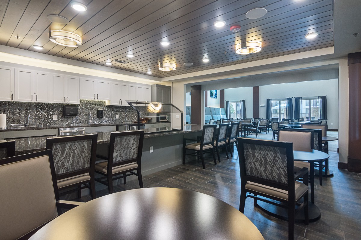 A modern dining area with stylish lighting and furnishings.