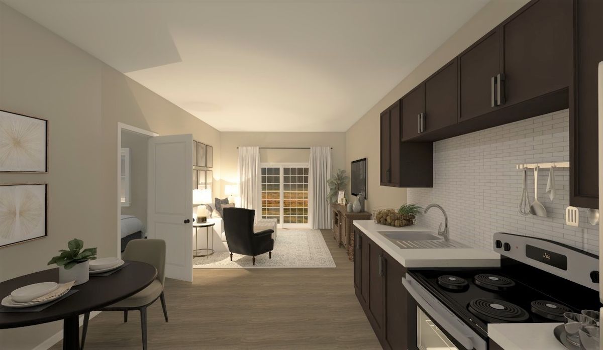 A modern open-concept living room and kitchen area with stylish furnishings.