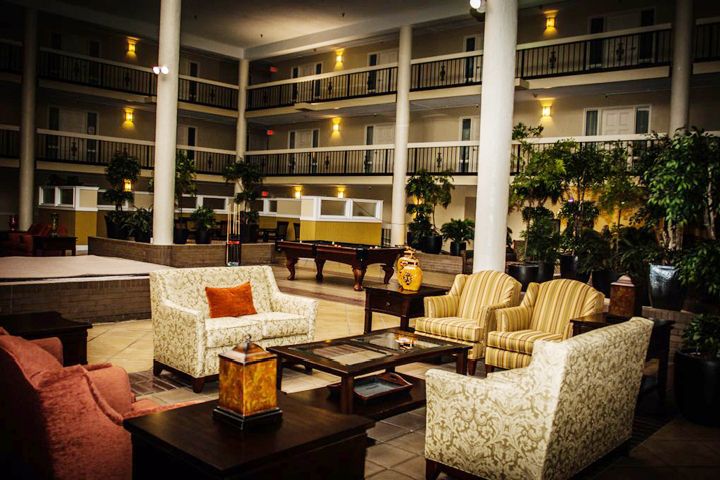 A stylish hotel lobby with comfortable seating arrangements and elegant decor.