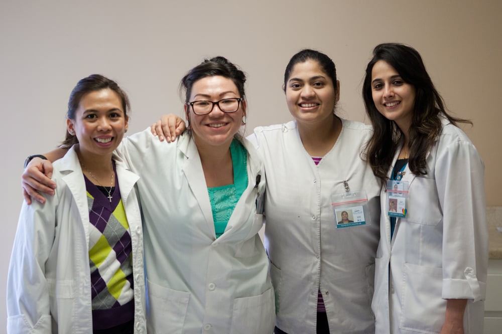 A group of healthcare professionals smiling together.