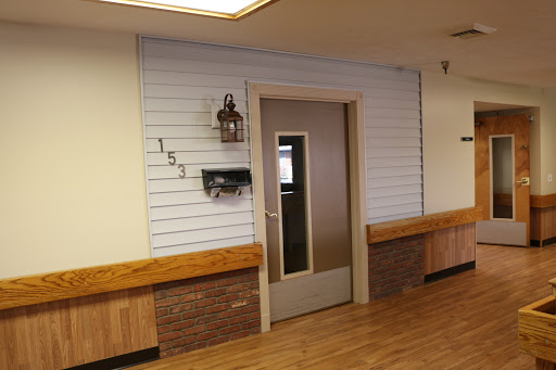 A well-designed interior space featuring a door, wooden accents, and decorative wall elements.