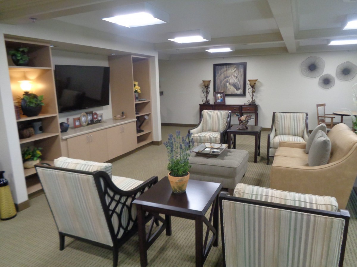 A cozy living room with comfortable seating and a television.