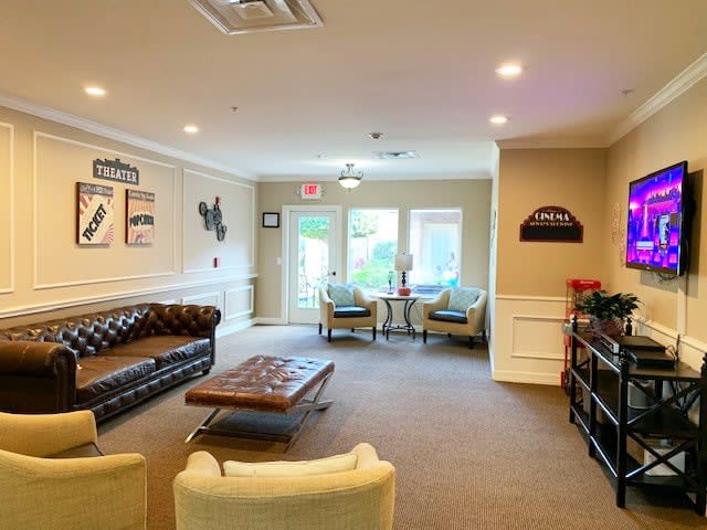A cozy living room with comfortable seating and elegant decor.