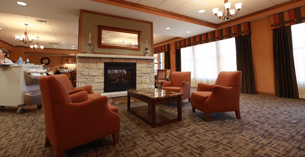 A cozy living room with a fireplace and comfortable seating.