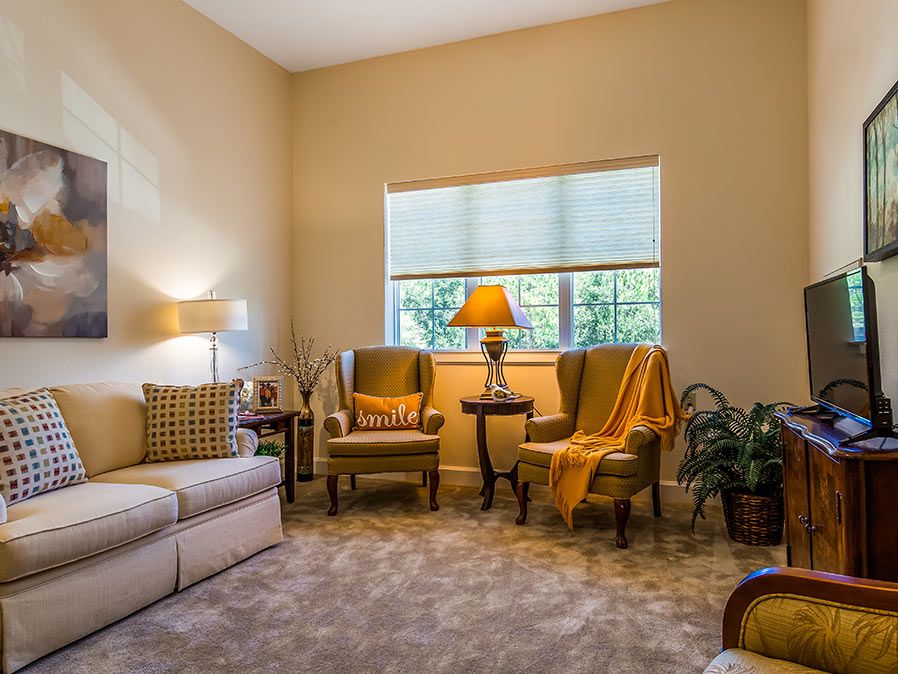 A cozy living room with comfortable seating and warm lighting.