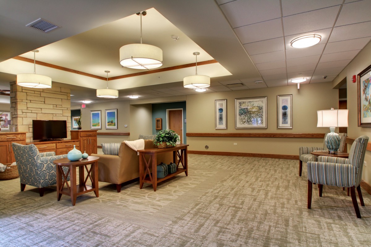 A well-lit lobby with comfortable seating and tasteful decor.