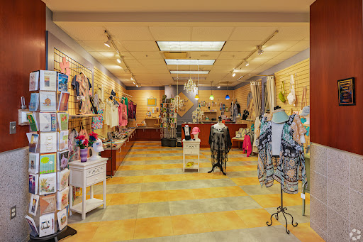An inviting retail space showcasing a variety of clothing and fashion items.