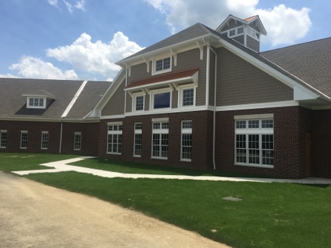 A modern residential building with a well-maintained landscape.