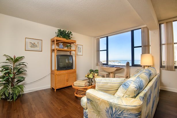 A cozy living room with a view of the ocean.