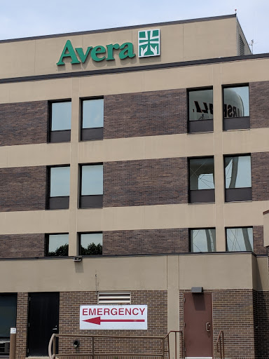 Avera hospital building with an emergency sign visible at the entrance.