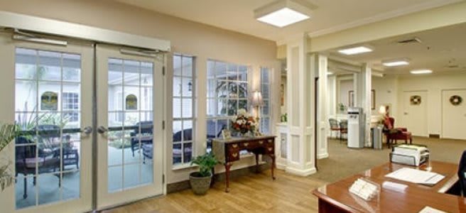 A welcoming lobby area with elegant furniture and large windows.