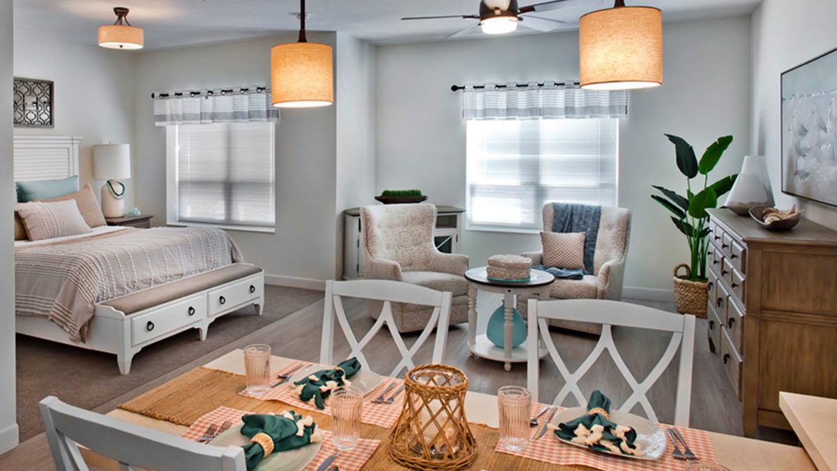 A cozy and stylish open-concept living and dining area with elegant decor and abundant natural light.