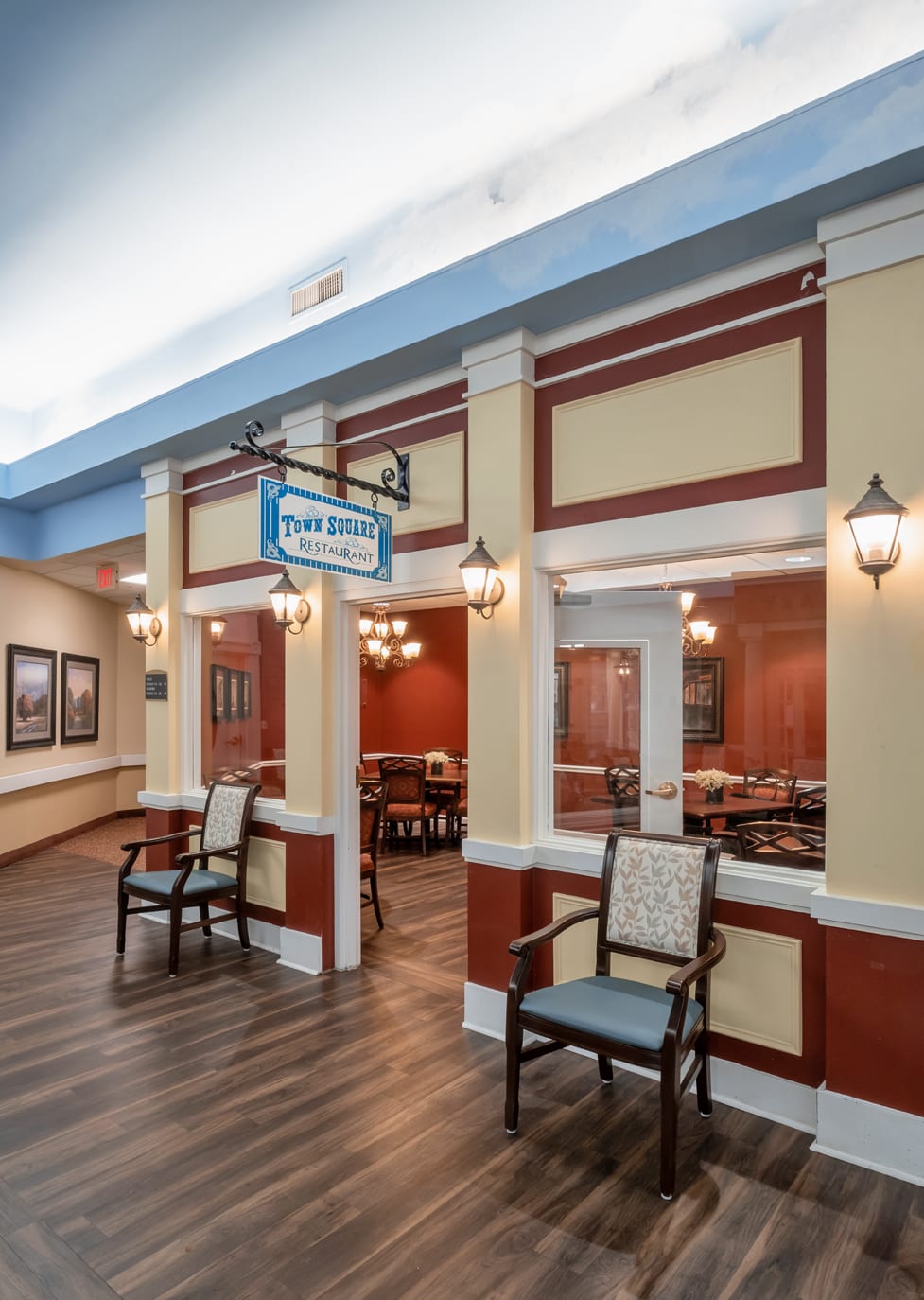 A cozy indoor seating area with classic architectural details and wall art.