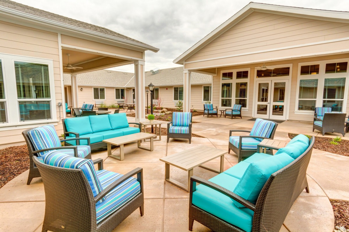 A modern outdoor patio with stylish seating arrangements.