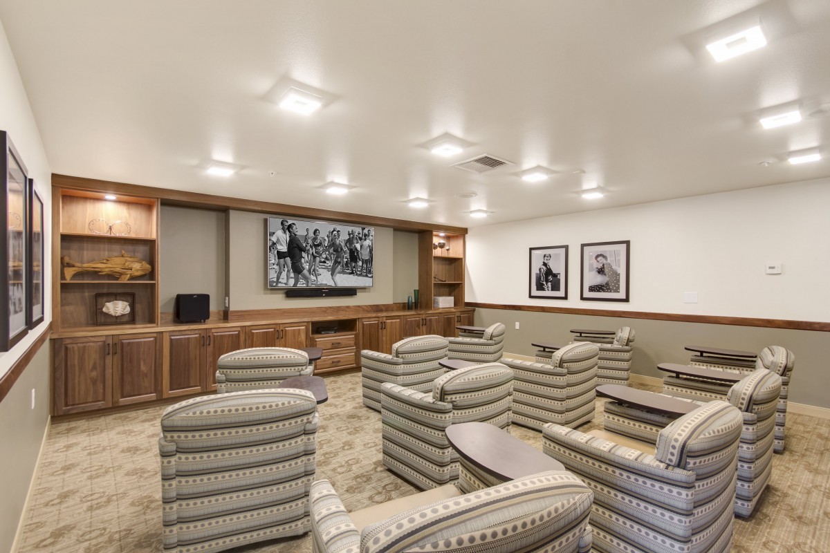 A cozy home theater with comfortable seating and ambient lighting.