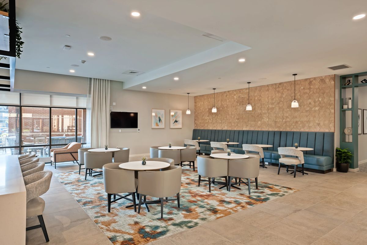A modern dining area with stylish seating and contemporary lighting.