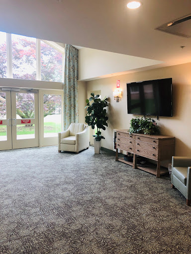 A cozy and modern living space featuring comfortable furniture and ample natural light.