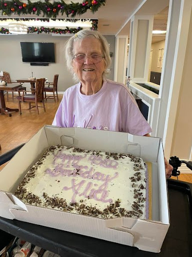A joyful celebration with a beautifully decorated birthday cake.