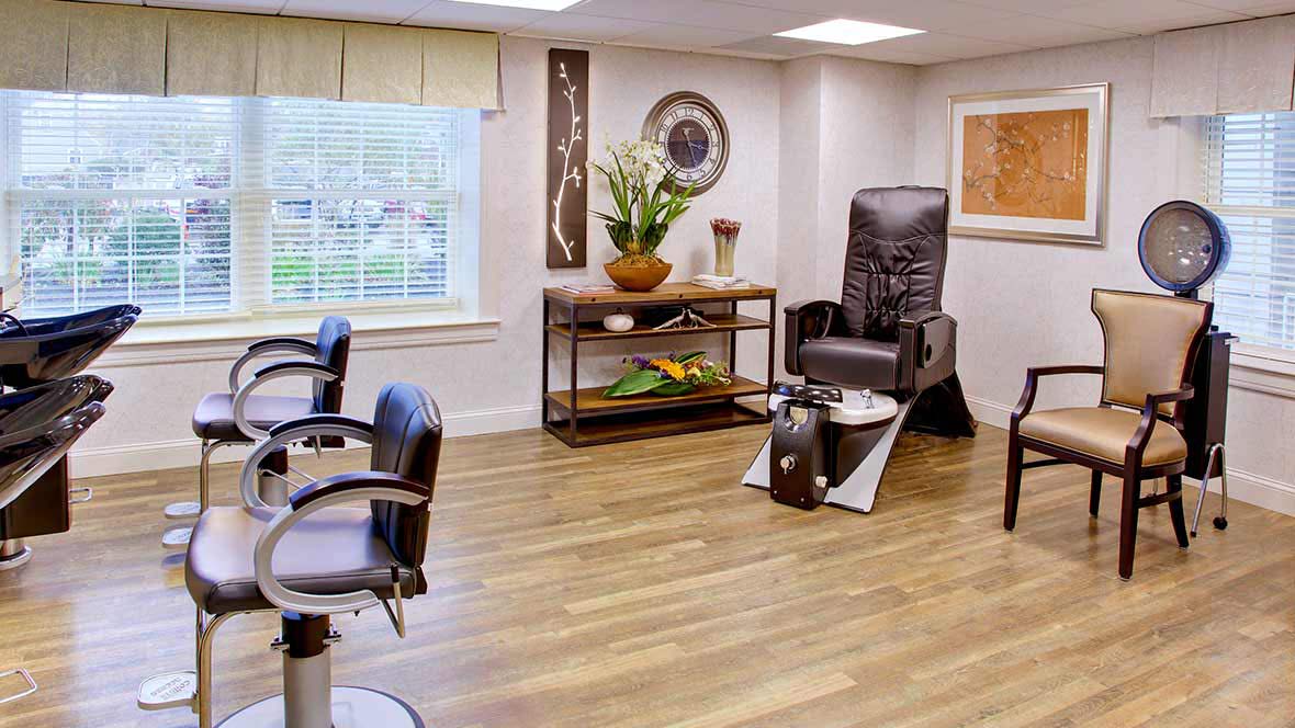 A modern beauty salon interior with comfortable seating and stylish decor.