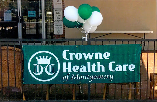 A welcoming sign for Crowne Health Care of Montgomery, adorned with festive balloons.