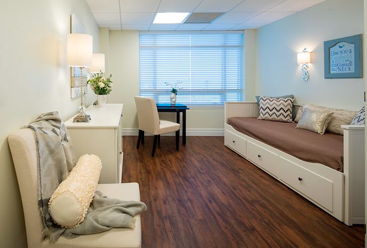 A modern and minimalist waiting room with comfortable seating and elegant decor.