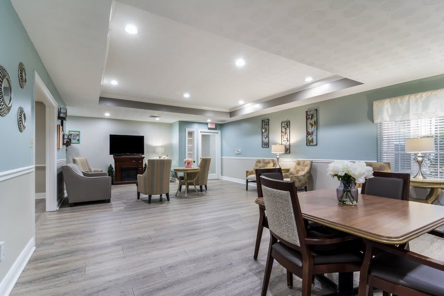 A modern living room with comfortable seating, a television, and tasteful decor.